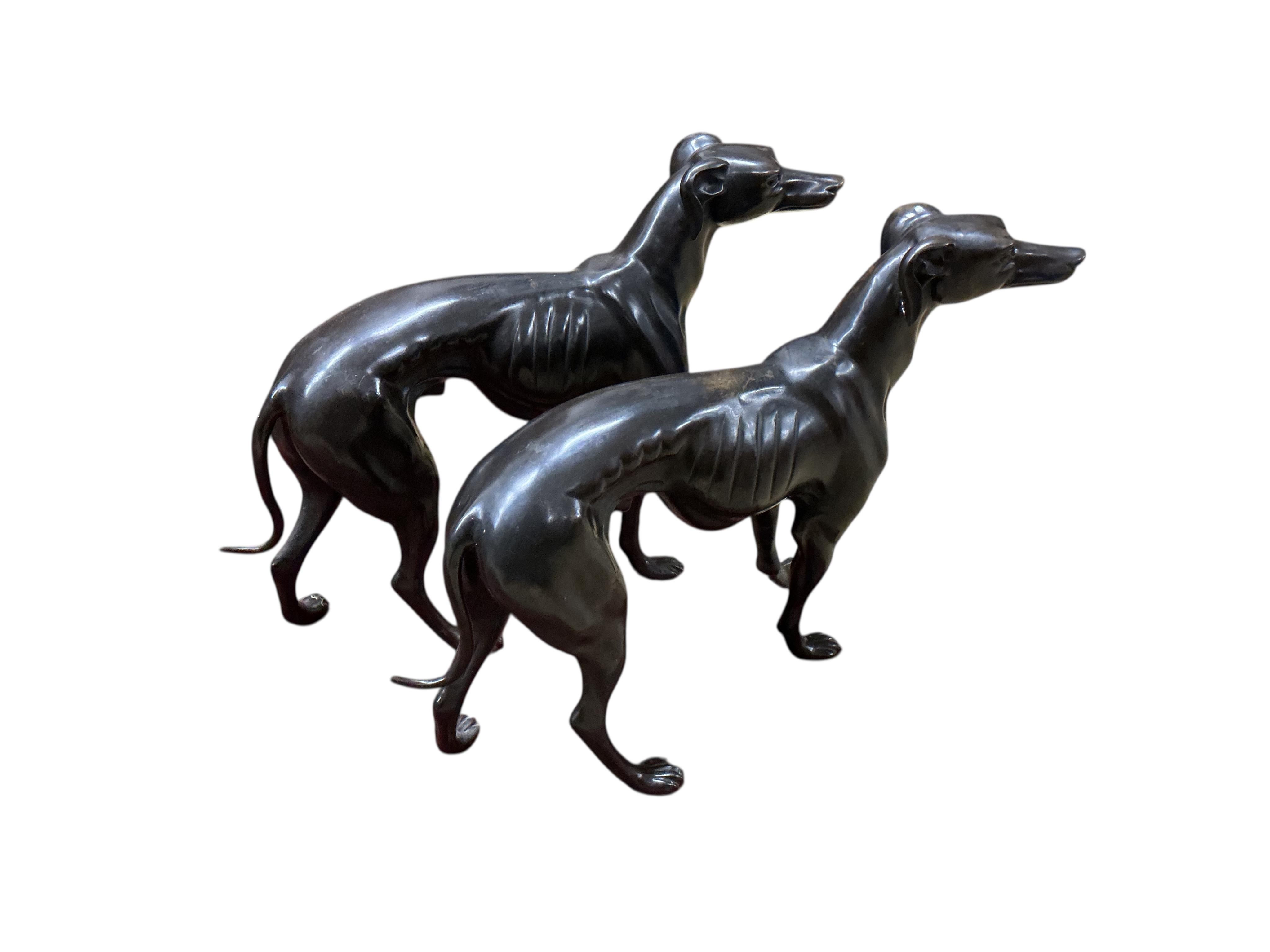 A pair of modern bronze models of greyhounds, length 70cm, height 51cm